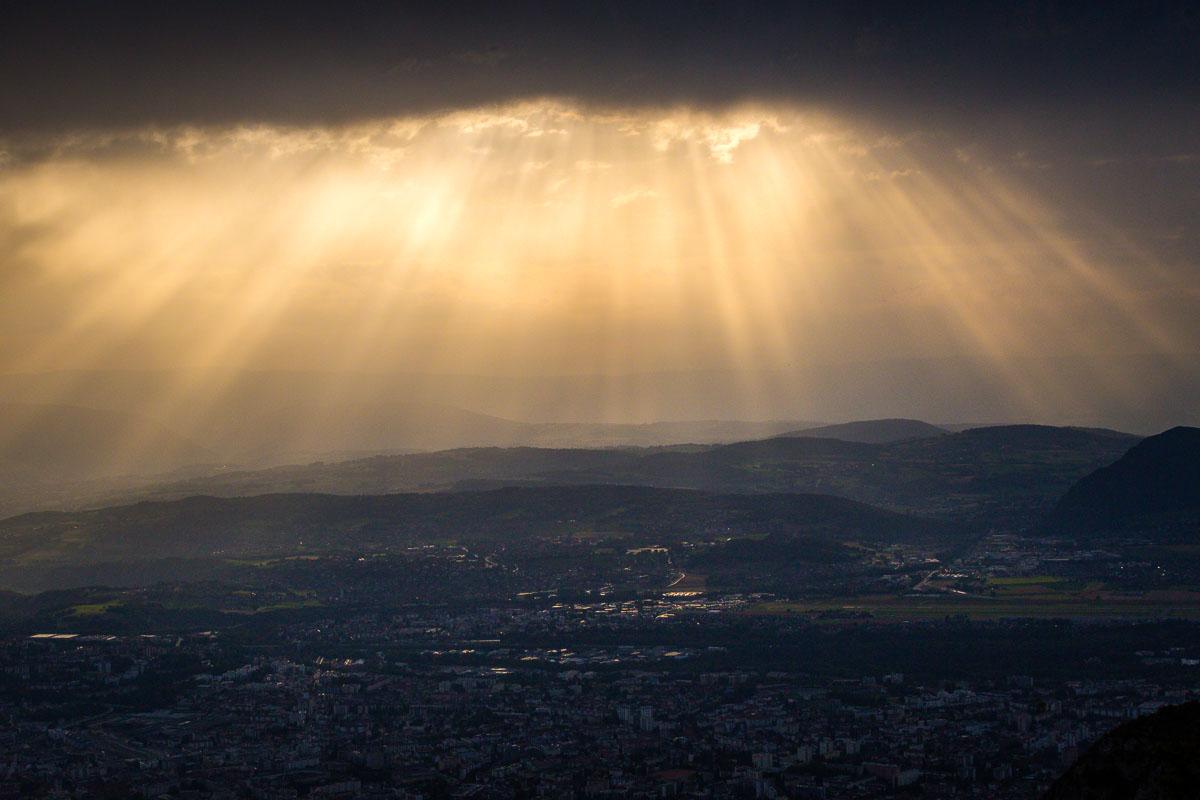 golden sun rays over annecy