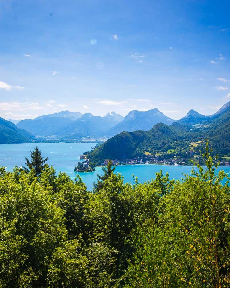 annecy mountains over the lake seen from le roc de chère