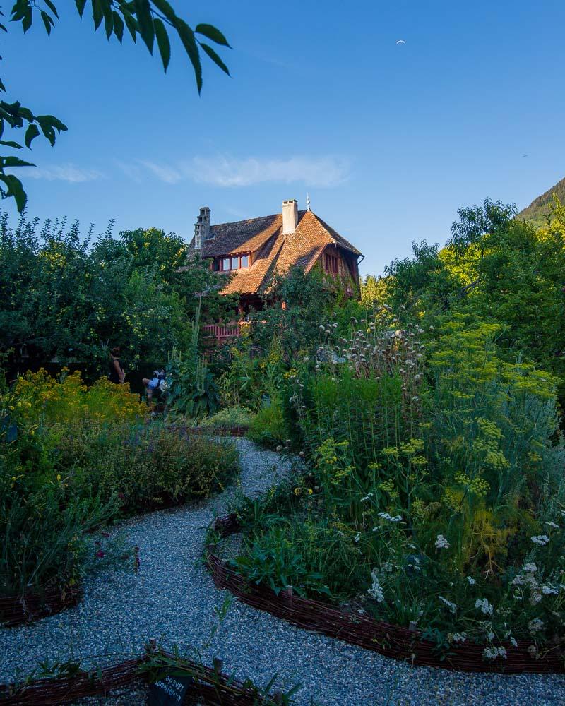 house in the garden of chateau de menthon