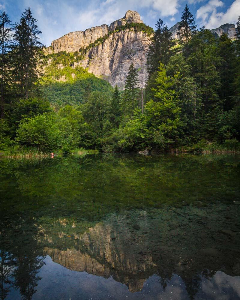 mountain reflecting in the lake at the start of the hike