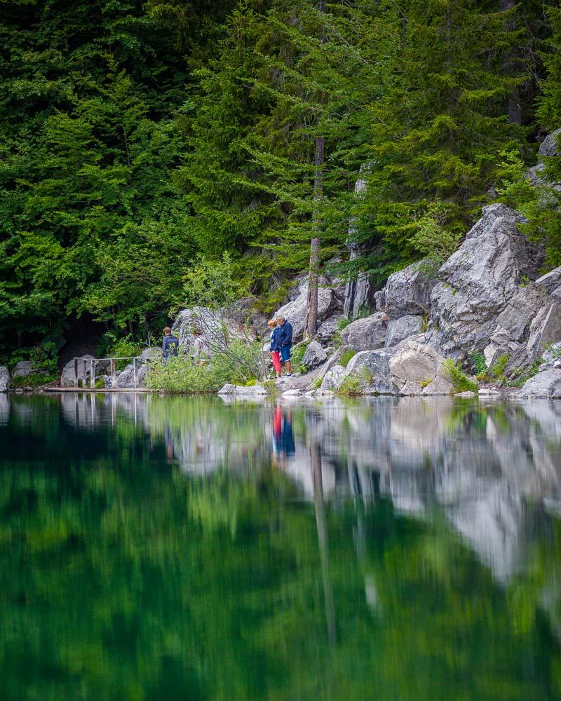 old couple looking at the water in lac vert servoz