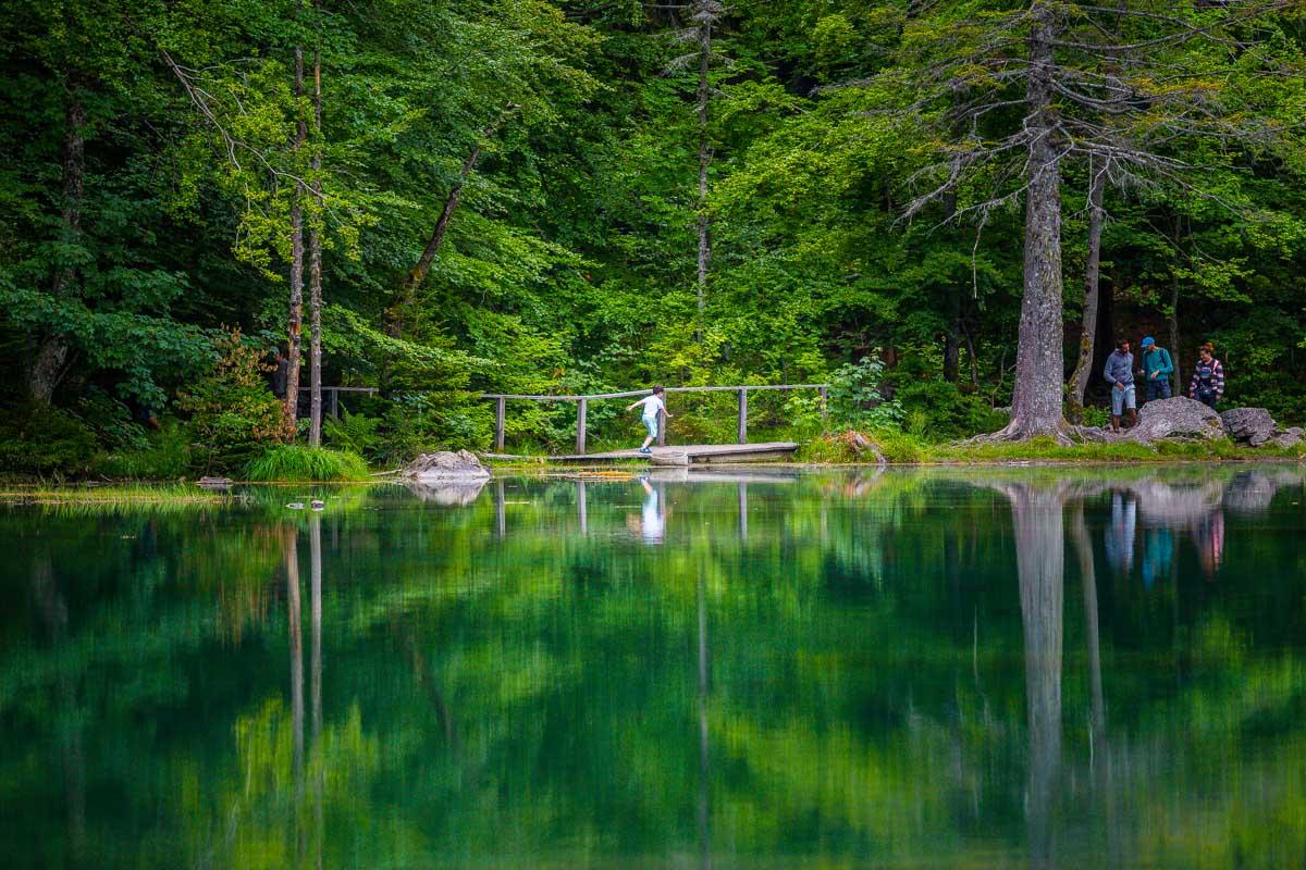 kid crossing the bridge in lac vert