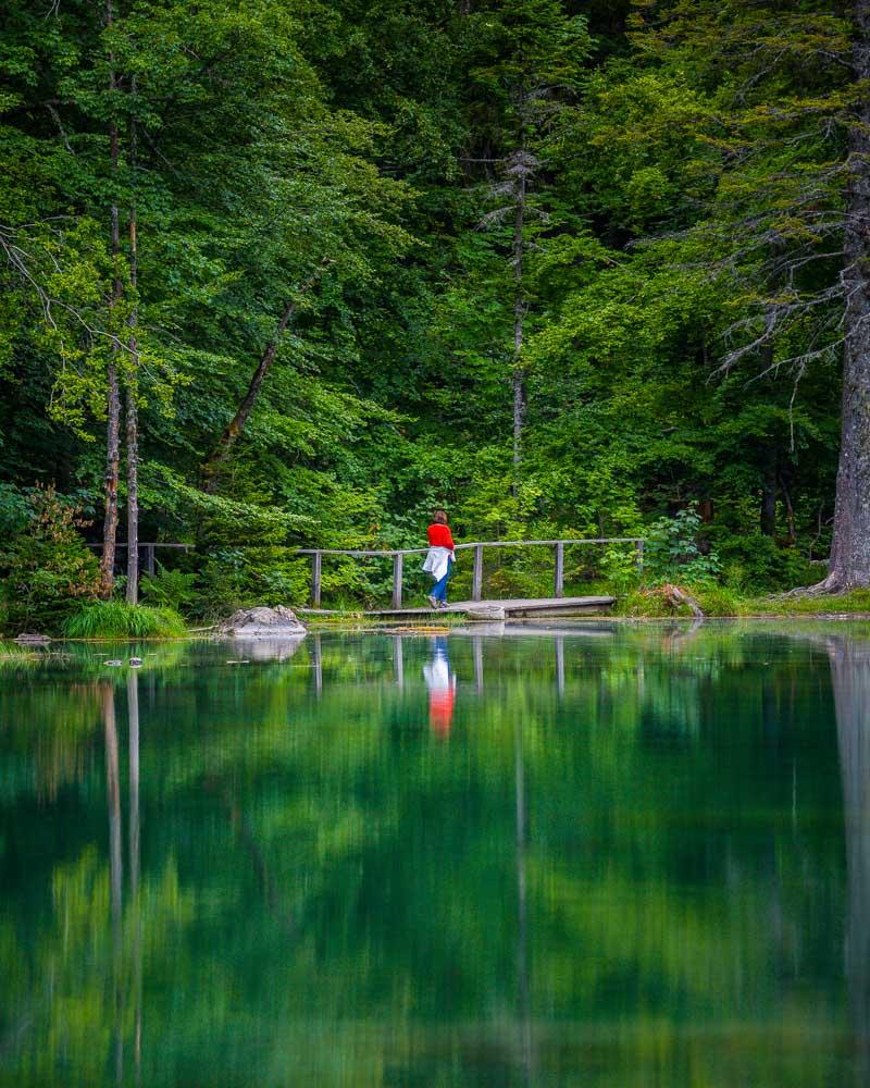 lady crossing bridge lac vert