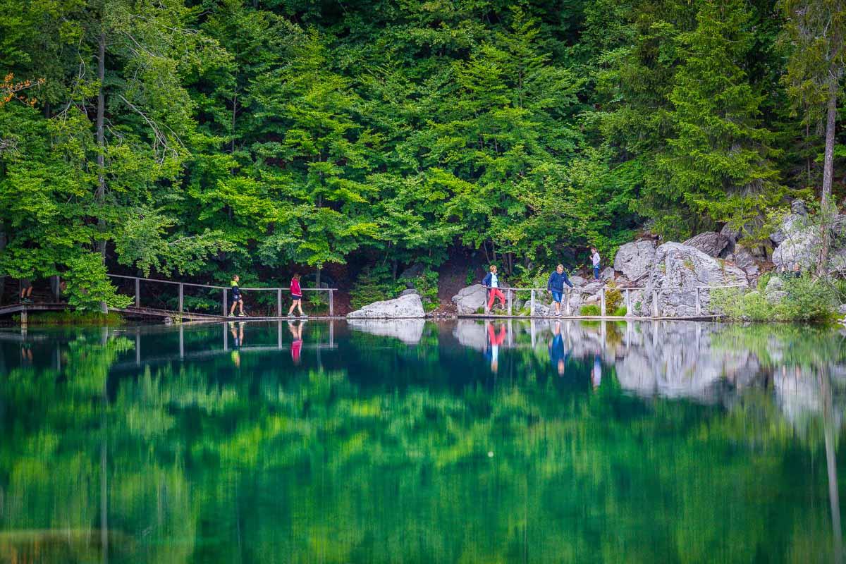 family crossing the bridge in lac vert