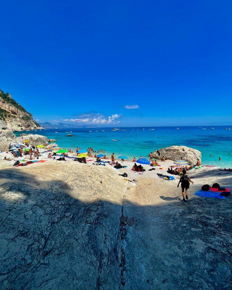 nes running on the beach after the hike cala goloritze