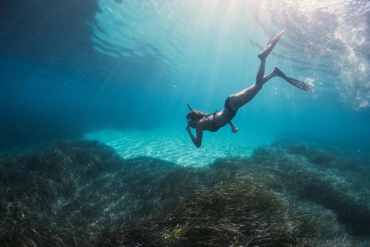 woman snorkeling in the mediterranean sea