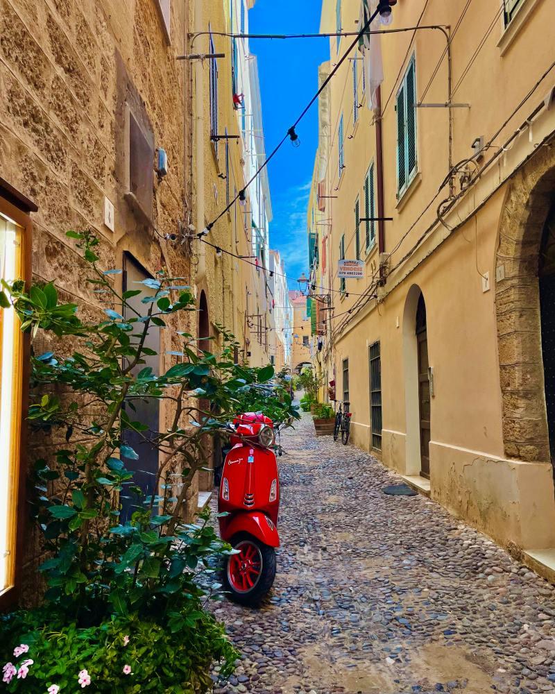 alghero must be on your sardinia road trip itinerary