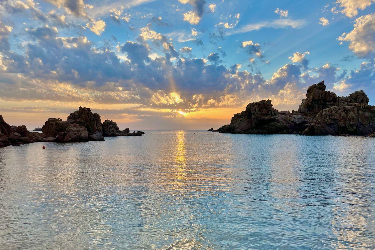 sunset view from cala li cossi beach