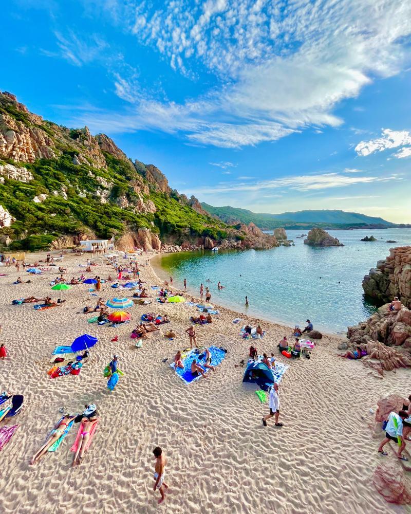 view of cala li cossi costa paradiso from the beach