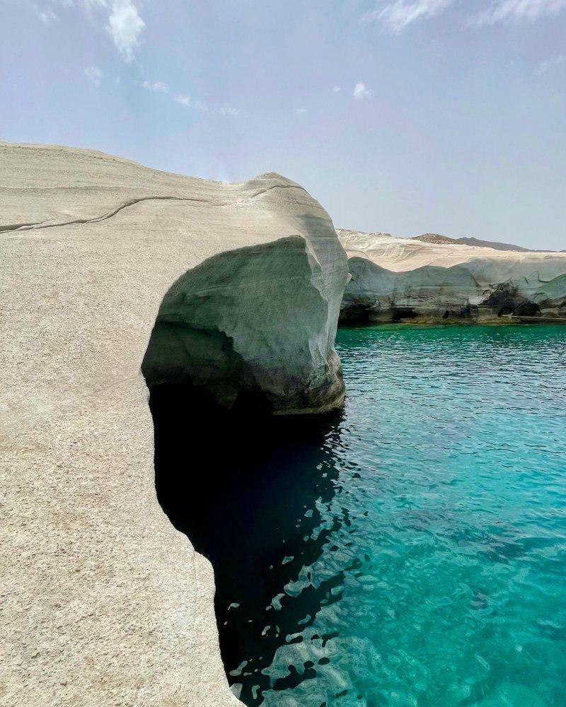 milos iconic beach and cliffs